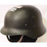 German WWII replica SS helmet in black with leather liner and chin strap, marked 66 TSR. P&P Group 3