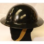 British WWII Home Front ARP wardens or Police Service helmet in black, with leather liner and one