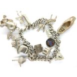 925 silver charm bracelet with fourteen charms, 49g. P&P Group 1 (£14+VAT for the first lot and £1+