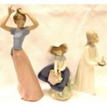 Lladro figurine girl with posy, a further Lladro girl with a chamberstick and a Nao girl, H: 26