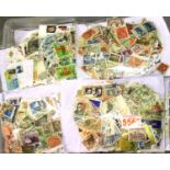 Thirty five bags of loose stamps mainly off paper, approximately 5kg. P&P Group 3 (£25+VAT for the