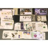 Selection of first day covers in a box and two albums. P&P Group 2 (£18+VAT for the first lot and £