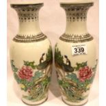 Pair of 20th century Chinese vases with peacock decoration, H: 32 cm. P&P Group 3 (£25+VAT for the