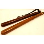 Two turned wood police truncheons, one engraved Leeds City Police, L: 44 cm. P&P Group 2 (£18+VAT