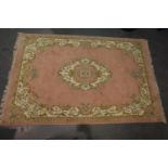 Chinese pink ground woollen rug, 275 x 180 cm. Not available for in-house P&P, contact Paul O'Hea at