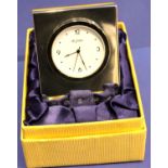 Carrs hallmarked silver mini clock, boxed with Millennium hallmarks. Working at loting up, cannot