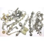 Tray of silver and white metal jewellery including a charm bracelet. P&P Group 1 (£14+VAT for the