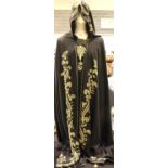 Hooded black cape with gold embroidered design. P&P Group 1 (£14+VAT for the first lot and £1+VAT