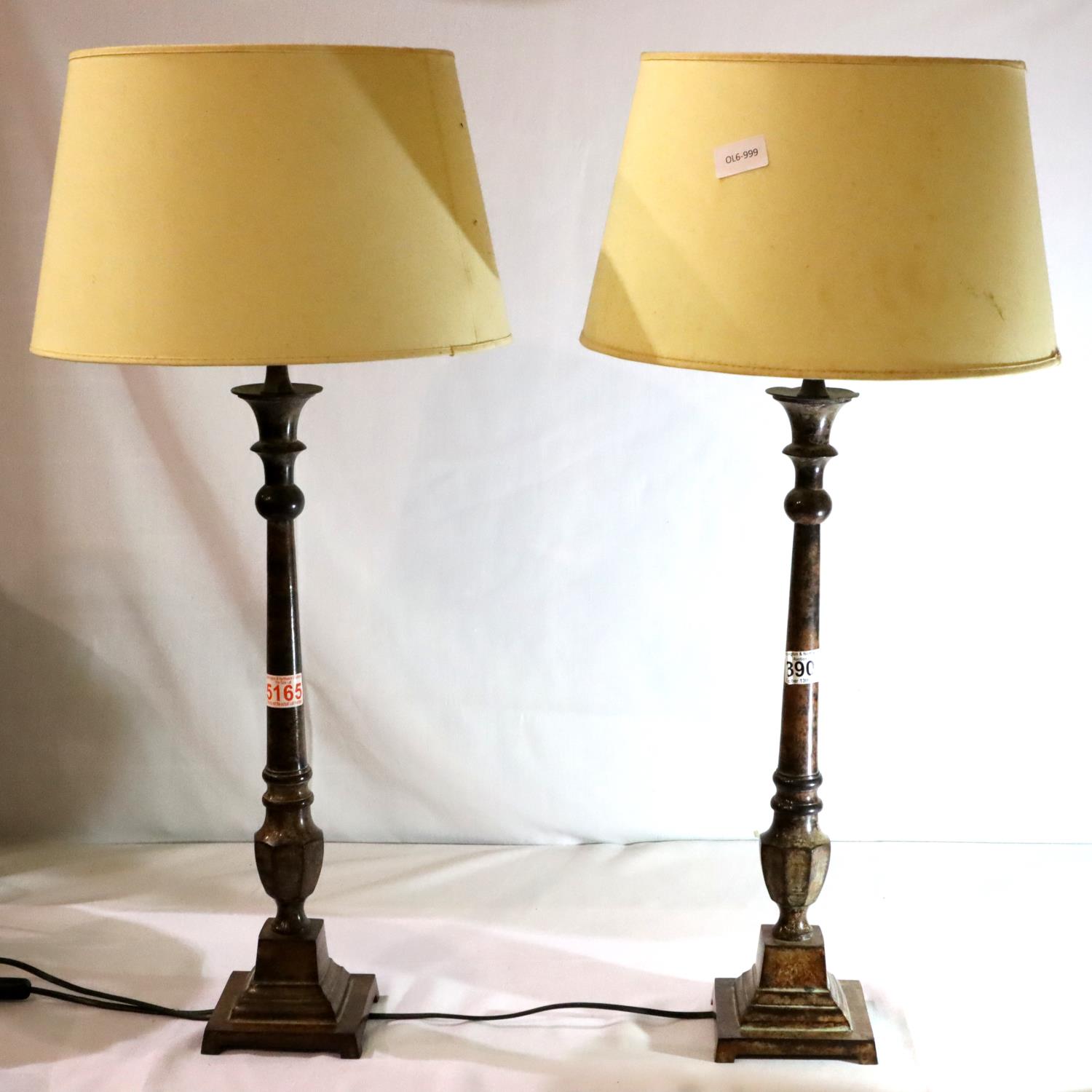 Pair of cast metal table lamps of monumental form with cream shades, overall H:75 cm. Not