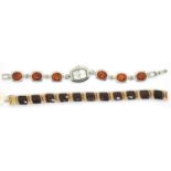 A Monet gold tone and red stone bracelet boxed and an amber and silver ladies bracelet watch by