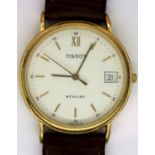 Gents Tissot wristwatch with white dial and date aperture and brown leather strap, requires battery.
