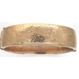 9ct gold wax filled snap bangle, 33.0g. P&P Group 1 (£14+VAT for the first lot and £1+VAT for