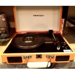Red/orange Crosley Cruiser 3 speed record player with power supply. working at time of lotting. P&