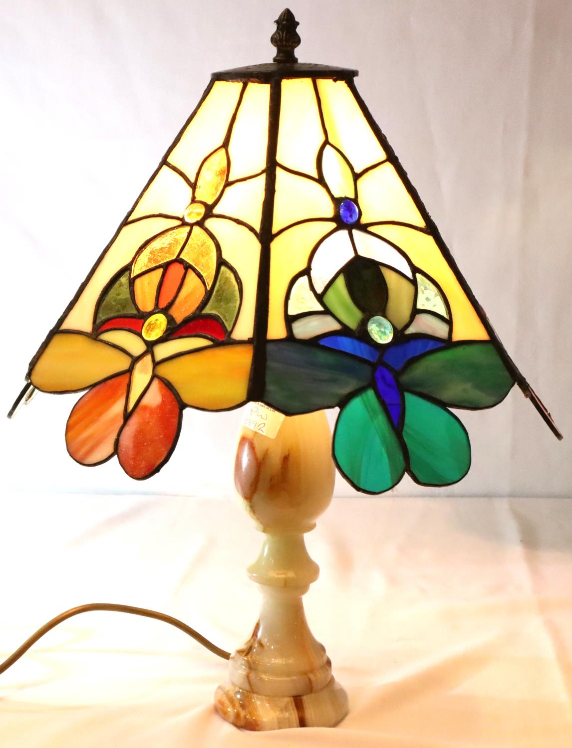 Tiffany style lamp on a turned onyx base, H: 50 cm. Not available for in-house P&P, contact Paul O'