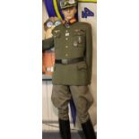 A museum arranged uniform of Erwin Rommel, comprising period and later pieces, including badged