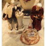 Three ceramic figurines to include a gentleman in period costume, a seated lady and a further