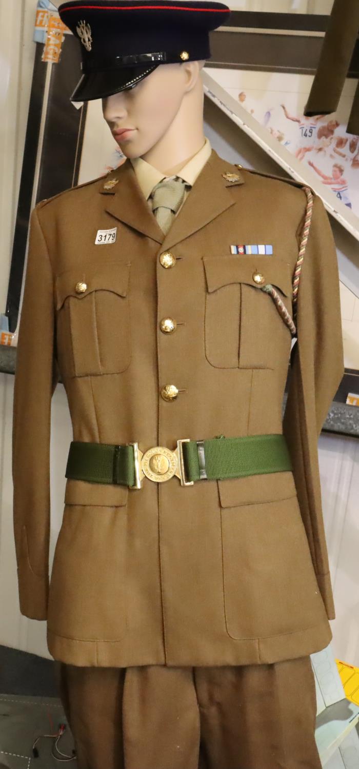 The Merlian regiment uniform, comprising tunic with ribbon bar, belt, trousers and cap with lanyard.