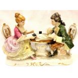 Dresden ceramic group of a couple playing backgammon, H: 18 cm. Not available for in-house P&P,
