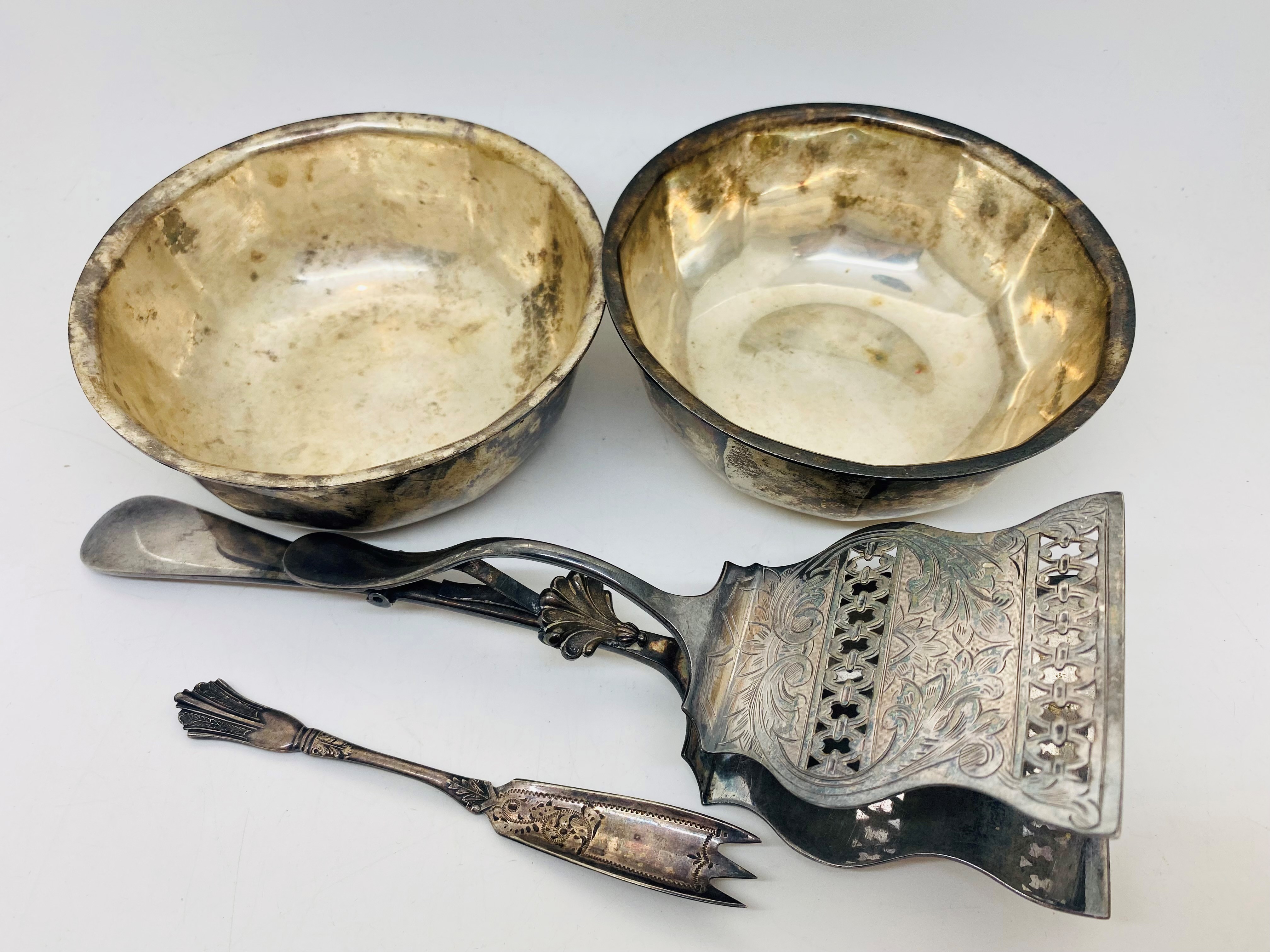 Silver plated pair of asparagus severs, pair of Elkington bowls and a pickle fork. P&P Group 2 (£