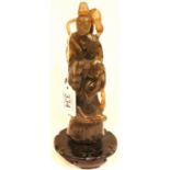 Substantial carved jade immortal figure raised on a carved circular base, figure has had repair,