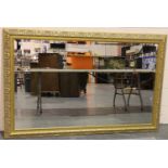 A substantial contemporary gilt framed rectangular mirror with bevelled glass, overall 170 x 110 cm.