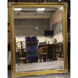 Large gilt frame bevelled edge wall mounted mirror, 102 x 132 cm. Not available for in-house P&P,