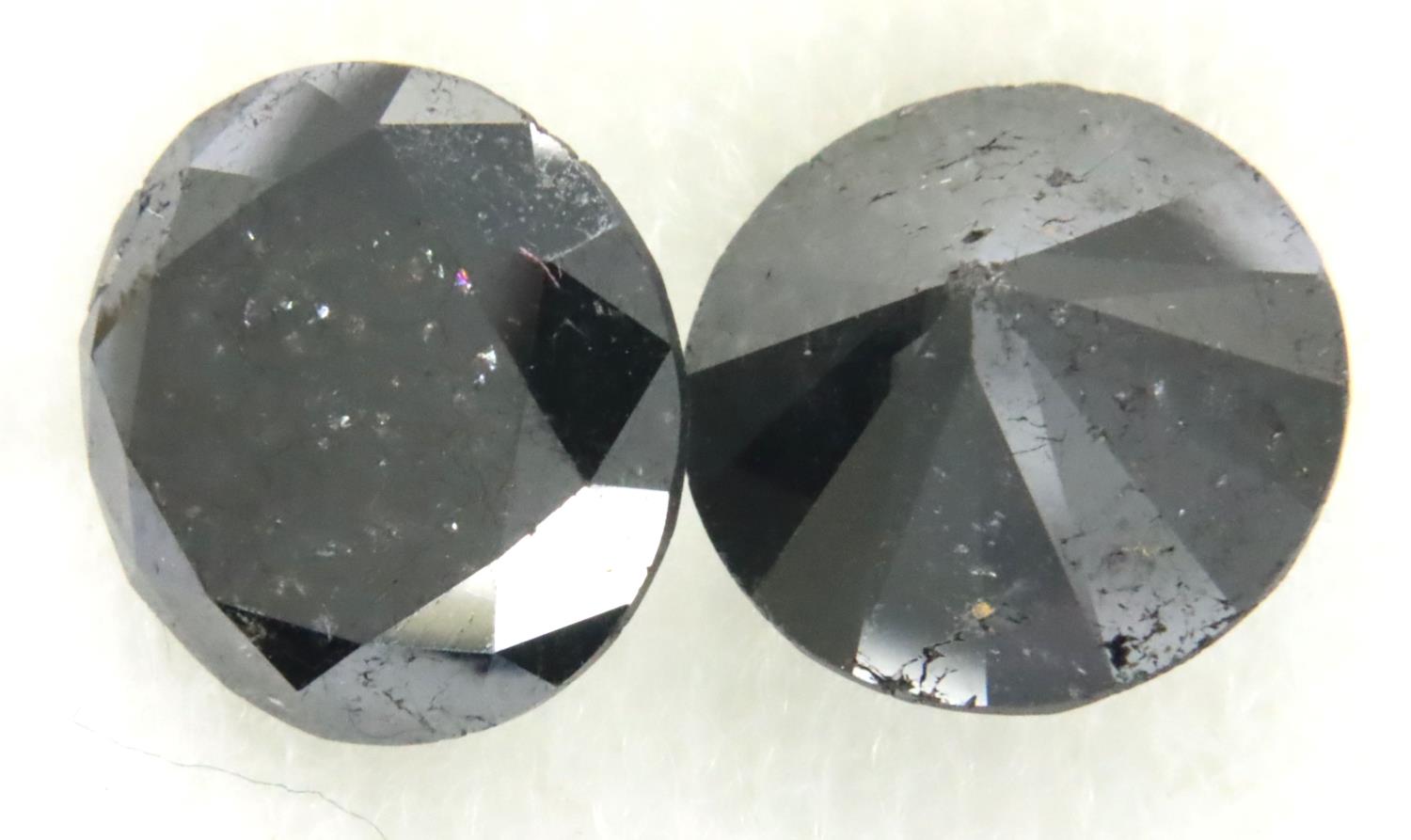 Two loose AIG certified black diamonds, each over 4cts. P&P Group 1 (£14+VAT for the first lot