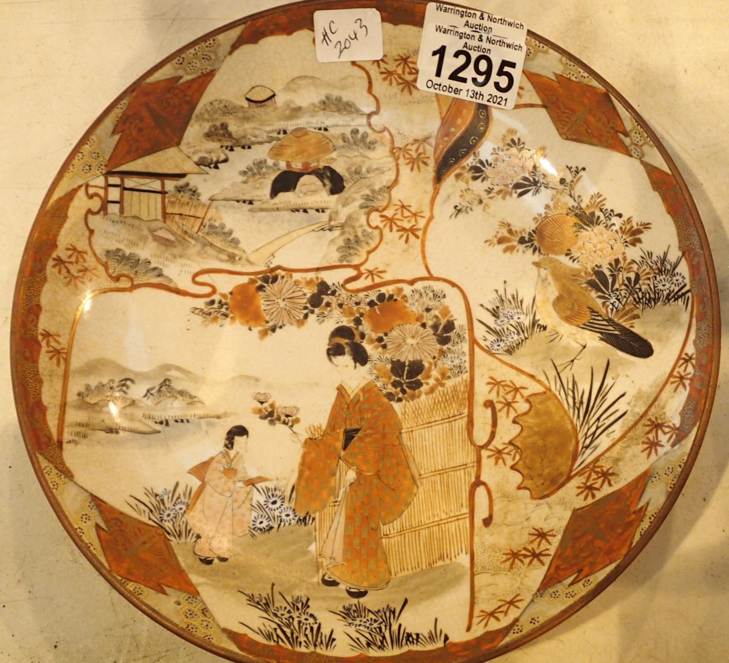 Japanese vintage dish depicting a Geisha in garden, D: 24 cm. Some crazing otherwise no damage. P&