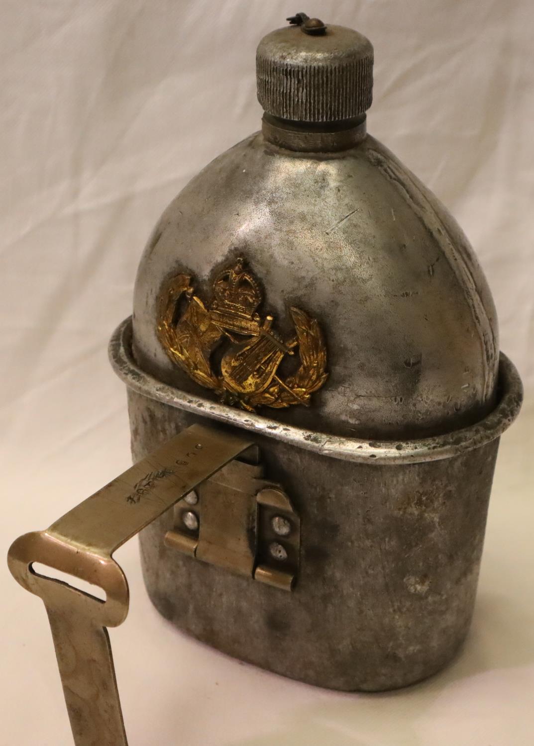 American WWI/WWII M1910 canteen with cup, mounted with an allied badge (unknown) semi relic