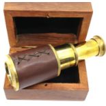 Boxed brass and leather two draw small telescope. P&P Group 1 (£14+VAT for the first lot and £1+