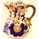 An early Ironstone ceramic pitcher of large proportions, moulded dragon handle and decorated in