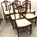 A set of six mahogany dining chairs, each with upholstered drop in seats. Not available for in-house