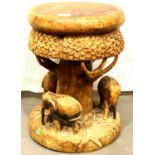 Heavily carved Ethnic tree form stool incorporating three elephants to the base. Not available for
