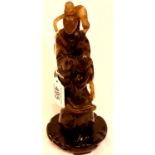 Substantial carved jade immortal figure raised on a carved circular base, figure has had repair,