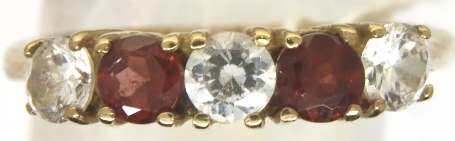 9ct gold garnet and white stone set ring, size P/Q, 3.0g. P&P Group 1 (£14+VAT for the first lot and