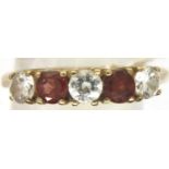 9ct gold garnet and white stone set ring, size P/Q, 3.0g. P&P Group 1 (£14+VAT for the first lot and