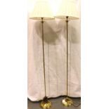 A pair of contemporary brass standard lamps, each H: 137 cm (including shades). Not available for