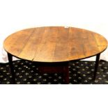 An 18th century country oak dropleaf table, 140 x 120 x 71 cm H (open). Not available for in-house