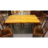 A 20th century pitch pine rectangular dining table with six 4 + 2 spindle back chair, 150 x 87 x