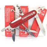 Three boxed Victorinox Swiss army style penknives with seven blades/tools. Not available for in-