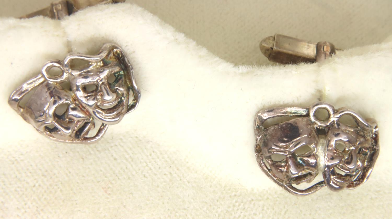 Pair of white metal cufflinks with theatrical masks. P&P Group 1 (£14+VAT for the first lot and £1+