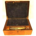 An Edwardian walnut writing slope, fitted with velvet lined slope, one inkwell with screw top and