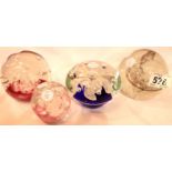 Four glass paperweights. P&P Group 2 (£18+VAT for the first lot and £3+VAT for subsequent lots)