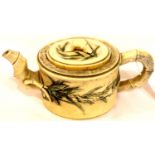 A 19th century heavily carved and painted Chinese ivory teapot, lined in pot, with bamboo form