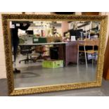 A substantial contemporary gilt framed rectangular mirror with bevelled glass, overall 132 x 103 cm.