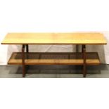 A mid 20th century rectangular teak coffee table with bergere under shelf, 130 x 55 x 46 cm H, no