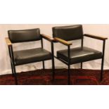 Two vintage black teak and metal armchairs made by Umist. Not available for in-house P&P, contact