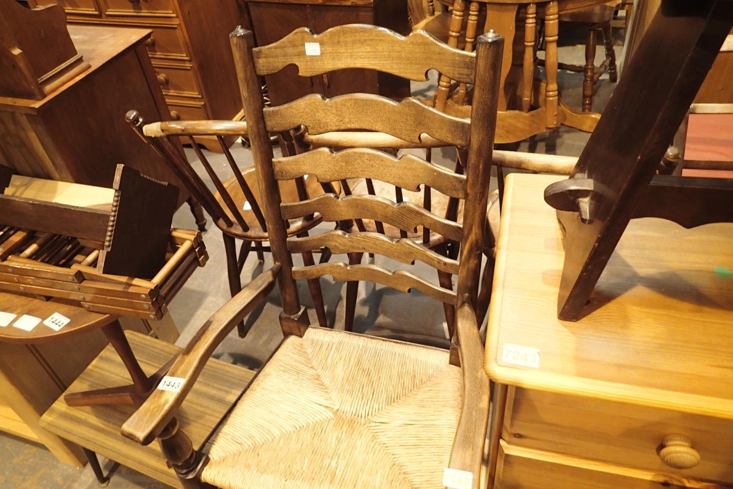 Large antique oak ladder back carver chair with rush seat, H: 110 cm. Not available for in-house P&