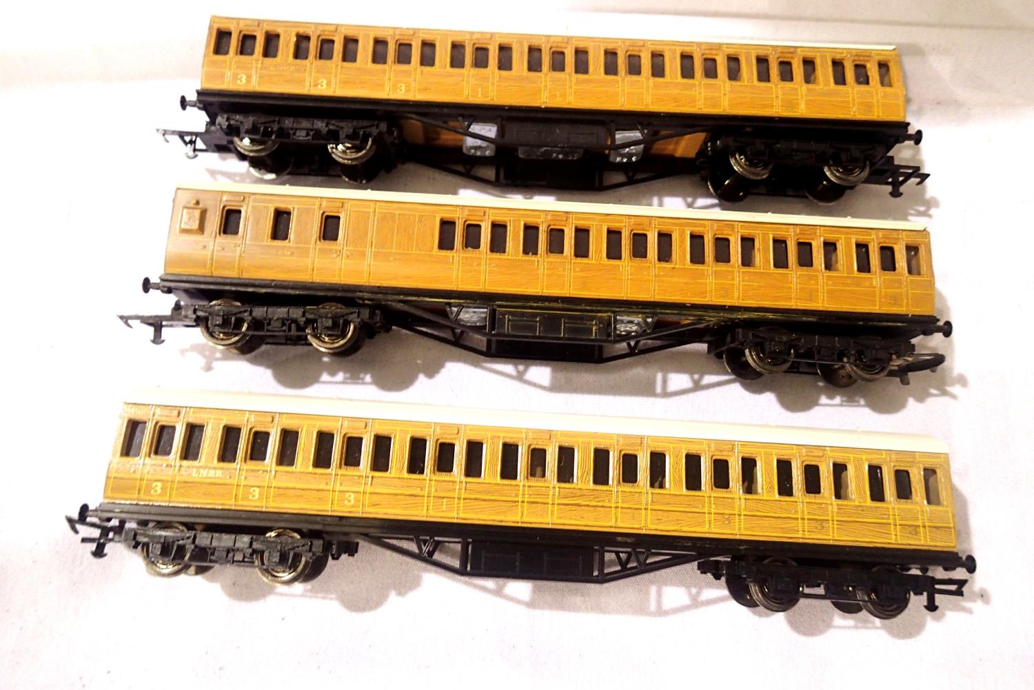 Three OO scale LNER teak suburban coaches, x2 composite and x1 brake end. Very good - excellent