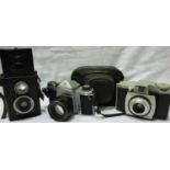 Mixed cameras including Pentax SIA with Super-Takumar 52mm F2 lens, a Voigtlander Brilliant